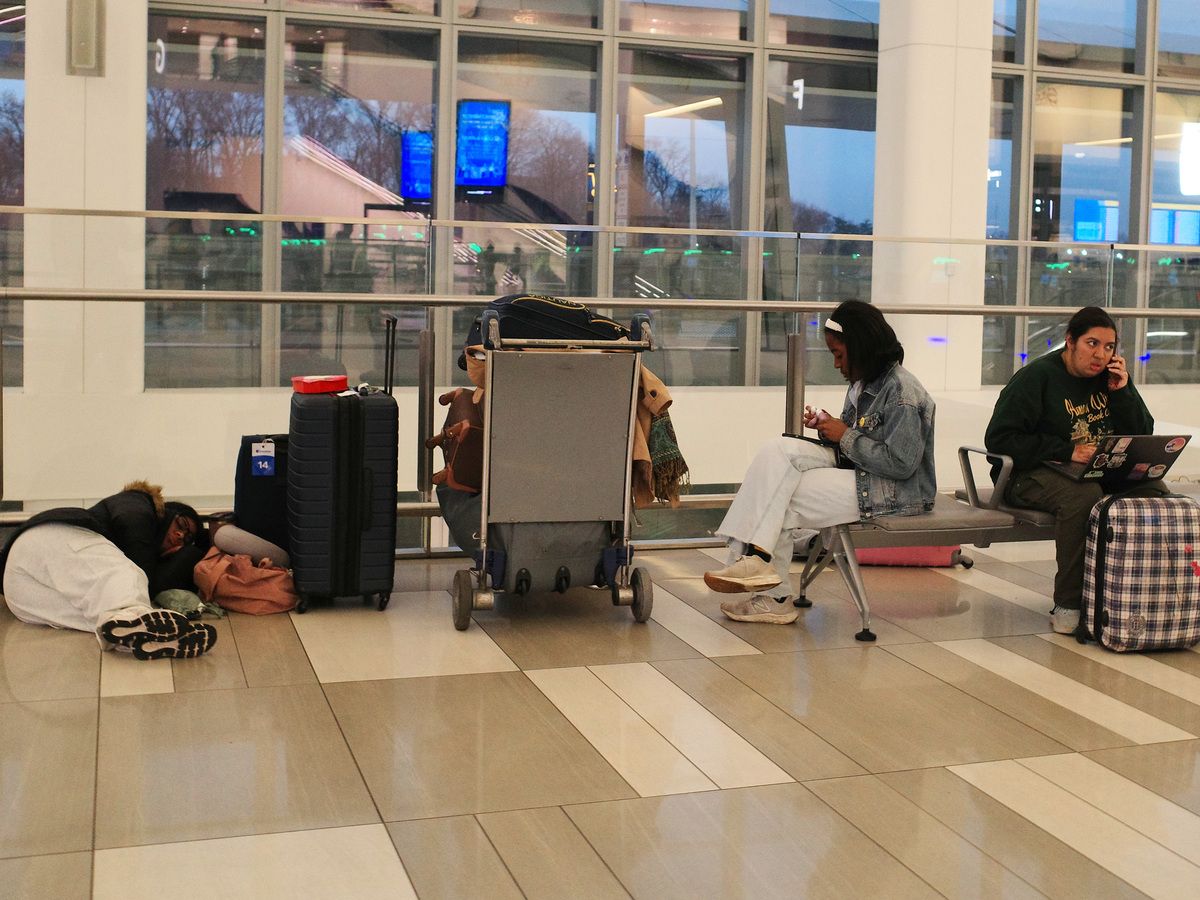  Passengers wait after flights were cancelled at Terminal B in LaGuardia Airport on March 23, 2026 in New York City.