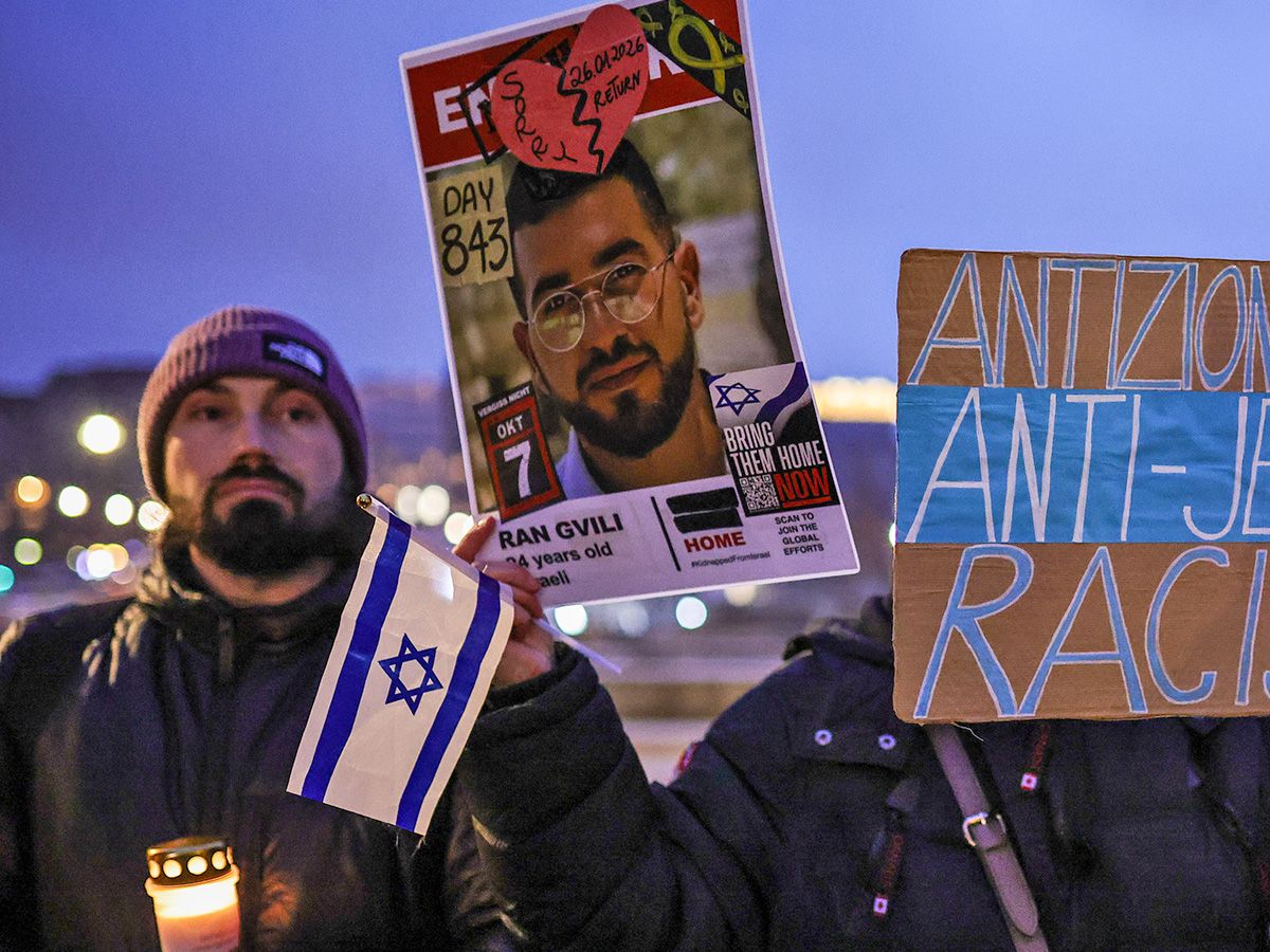  A German supporter of Israel holds a photo of Ran Gvili, the last Israeli hostage held by Hamas, who’s body was recovered on Jan. 26, 2026