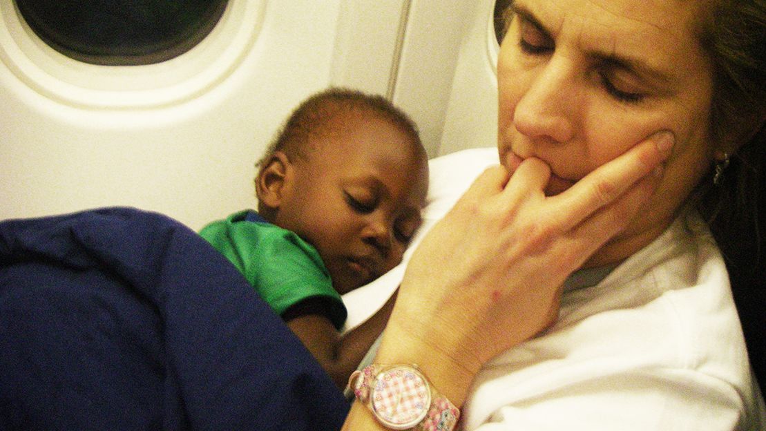 Two-year-old Kendy Joseph sleeps with Air Canada employee Louise Thériault aboard the airline’s relief mission flight from Port-au-Prince to Ottawa on Jan. 23, 2010. Kendy, adopted by a B.C. family, is now Maddox Bentley, a 17-year-old, six-foot-two student at a hockey academy.