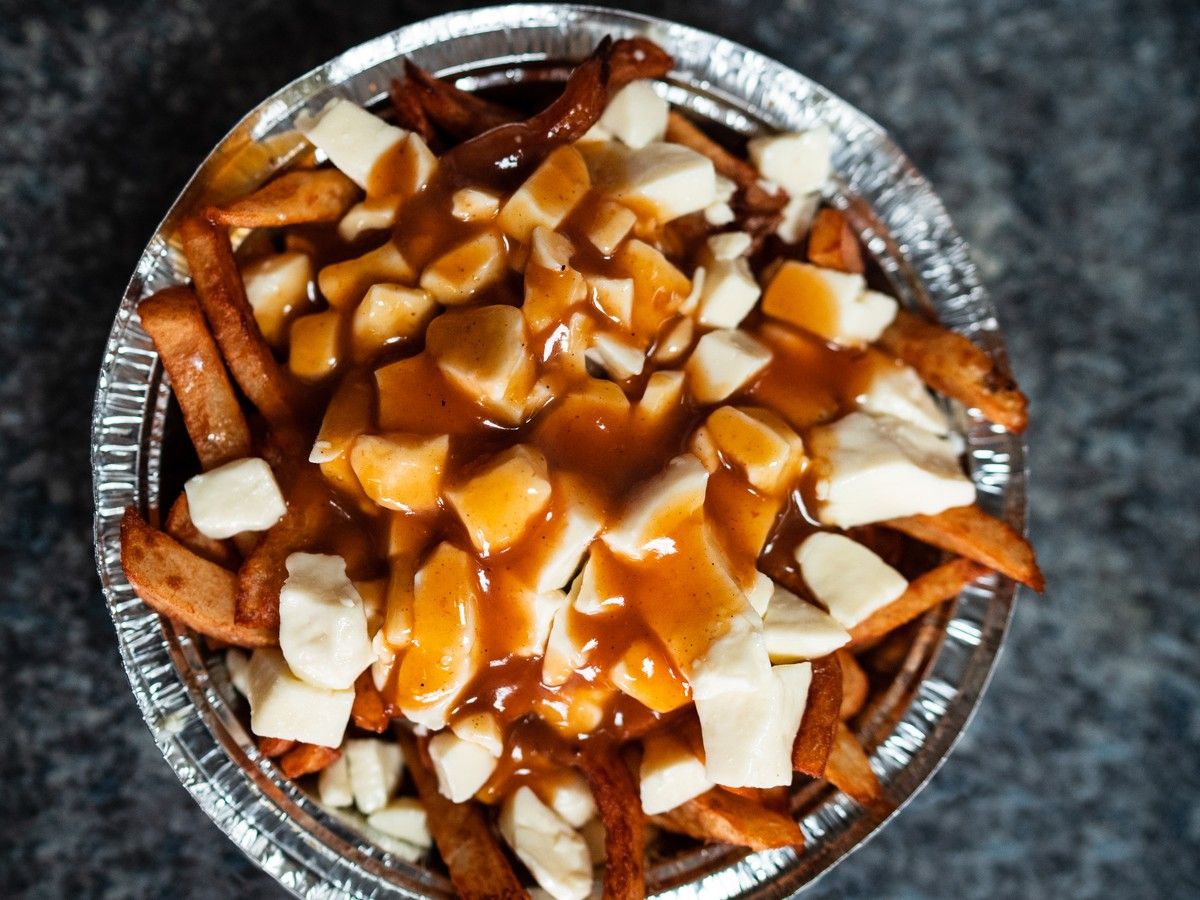Poutine, a Québécois dish of french fries, cheese curds and gravy. Quebec is moving toward protected status for the cheese curds, which are produced in the province.