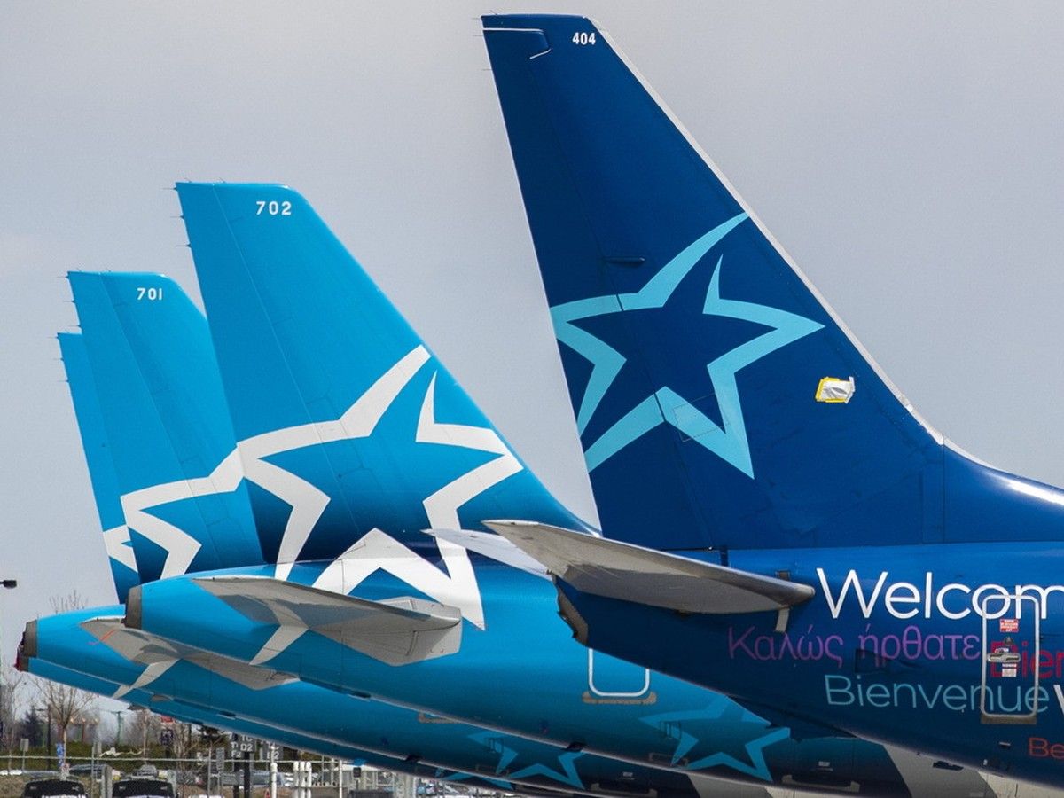 Idle Air Transat jets sit parked at Montréal-Pierre Elliott International Airport in Montreal.