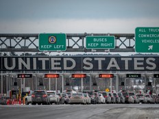 Cars wait in line to enter the United States at a border crossing at the Canada-US border in Blackpool, Quebec, Canada, on February 2, 2025.