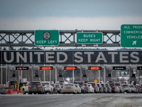 Cars wait in line to enter the United States at a border crossing at the Canada-US border in Blackpool, Quebec, Canada, on February 2, 2025.