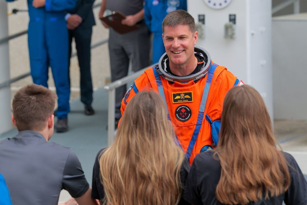 Mission specialist Jeremy Hansen of Canadian Space Agency speaks to his family as he walks out of the Neil A. Armstrong Operations and Checkout Building ahead of the launch of the Artemis II at NASA’s Kennedy Space Center on April 1, 2026 in in Cape Canaveral, Florida. 