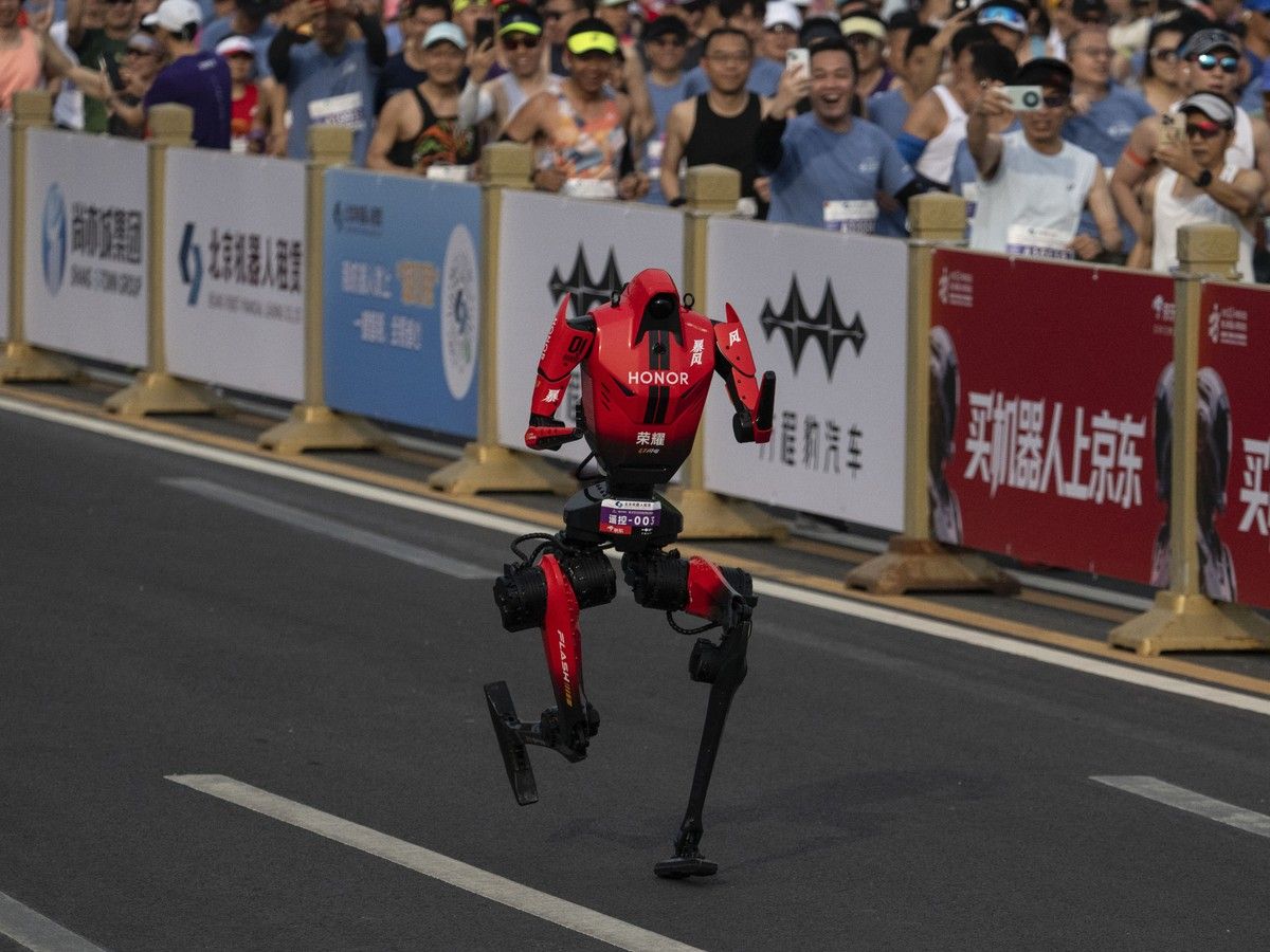 Robot breaks half-marathon world record by almost seven minutes in Beijing