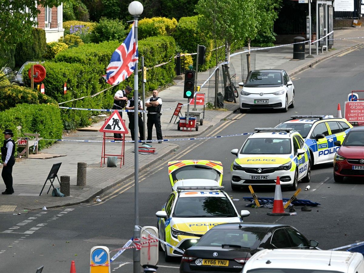  Items including clothes and trainers are pictured strewn in the road inside a police cordon on Golders Green Road, after two people were stabbed. A man was arrested after he was seen running with a knife “attempting to stab Jewish members of the public”, the Shomrim Jewish neighbourhood watch said on social media. (Photo by JUSTIN TALLIS / AFP via Getty Images)
