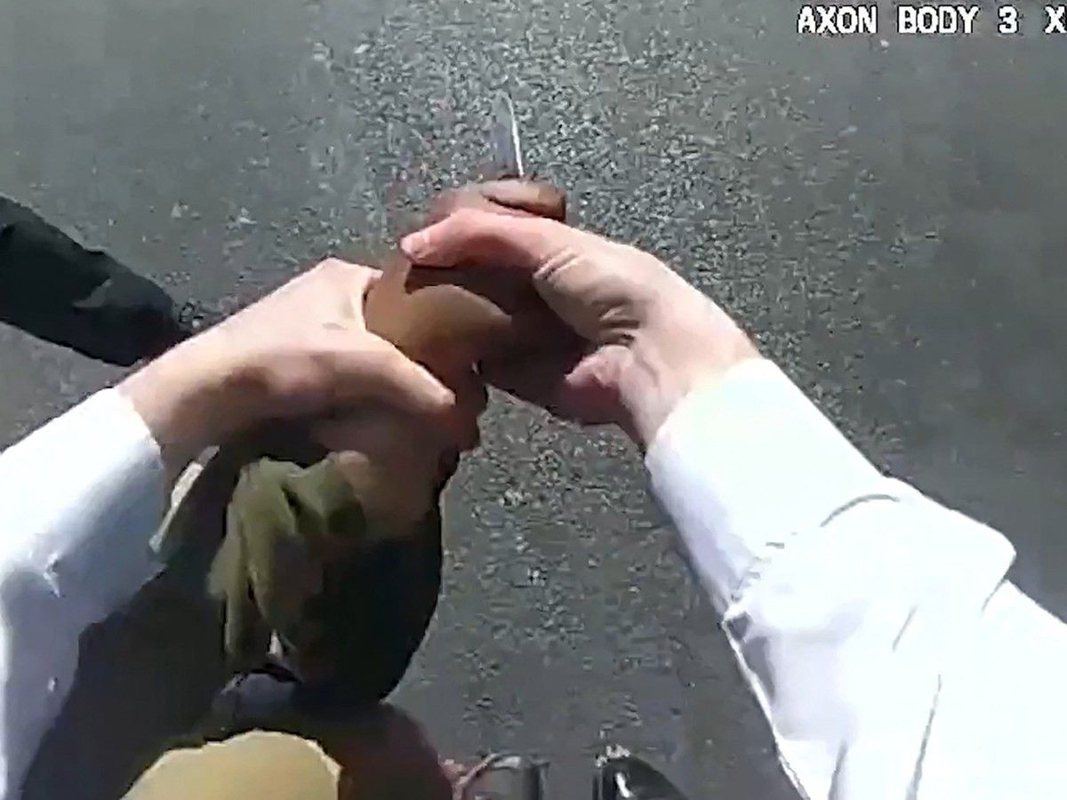  A screen grab taken from body camera video shows London police trying to disarm a man holding a knife, after he allegedly stabbed two people nearby.