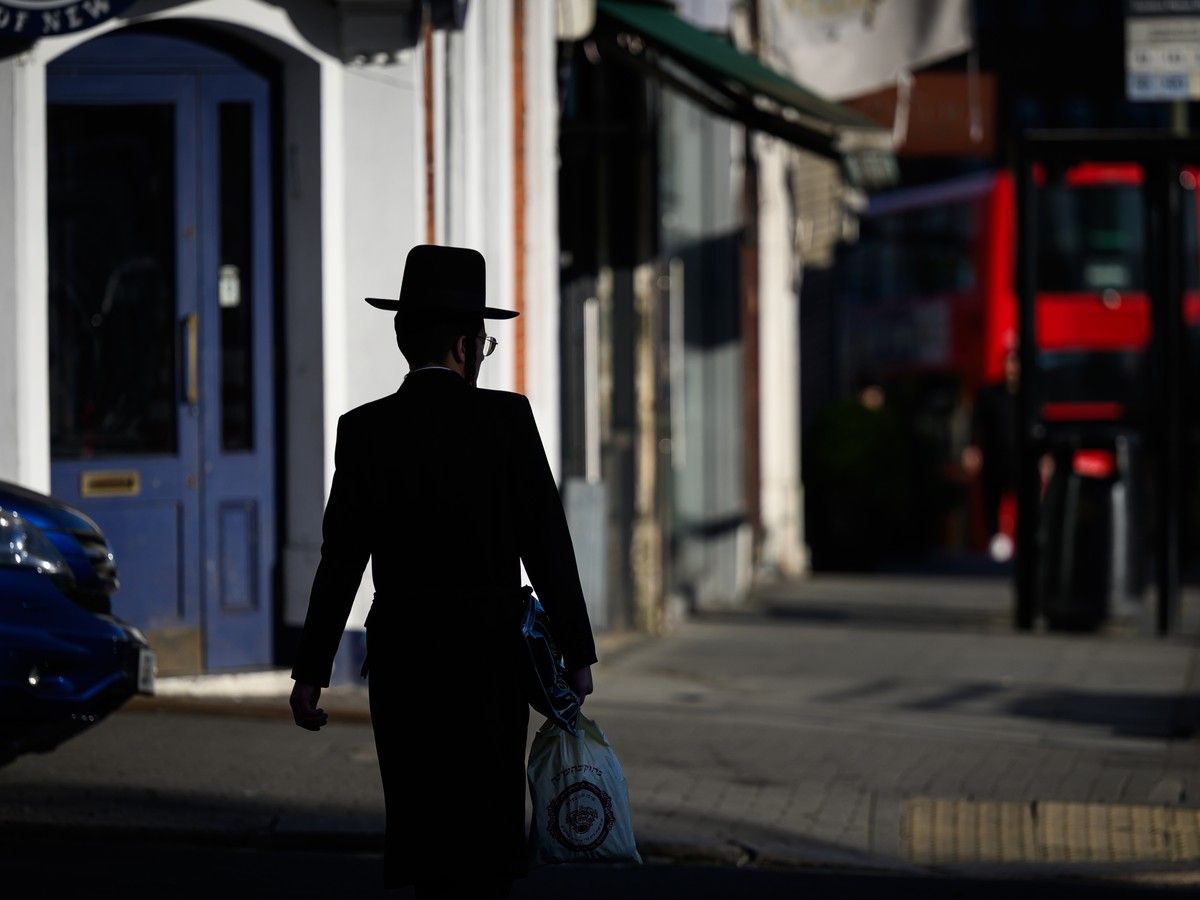  A young Orthodox Jew walks towards the bus stop where a man was attacked yesterday in in a terrorist incident in London, England.The suspect, aged 45, was tasered and arrested.The two victims were taken to hospital and are in stable condition. (Photo by Leon Neal/Getty Images)