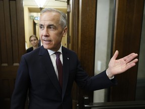 Prime Minister Mark Carney walks to the House of Commons to introduce new Members of Parliament on Parliament Hill in Ottawa April 27, 2026.