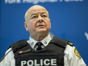 Myron Demkiw wearing a police vest