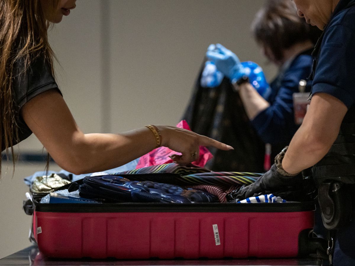  Custom officer inspects a traveller’s suitcase at Marseille-Provence airport in France, on May 11, 2026.