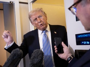 Trump speaking to reporters on Air Force One