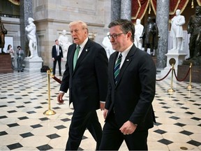 Donald Trump, left, and Mike Johnson, right