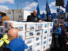 Boxes of signatures at a rally.