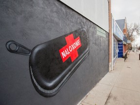 A large mural of a Naloxone kit is featured on the front of AIDS Saskatoon's supervised consumption site.