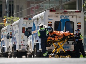 Paramedics unload a patient