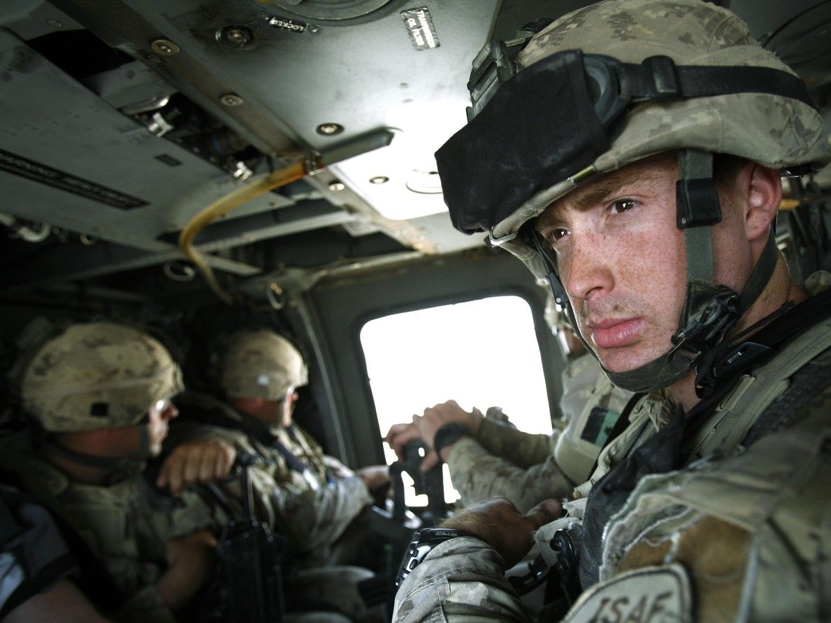 A soldier in a helicopter
