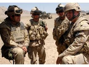 Soldiers talking in Afghanistan