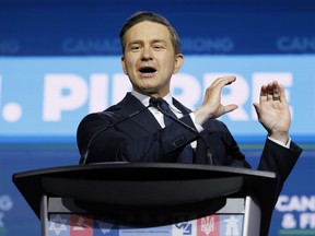 Conservative Party of Canada leader Pierre Poilievre delivering a speech from behind a lectern.