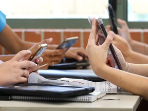 Children looking at their phones.