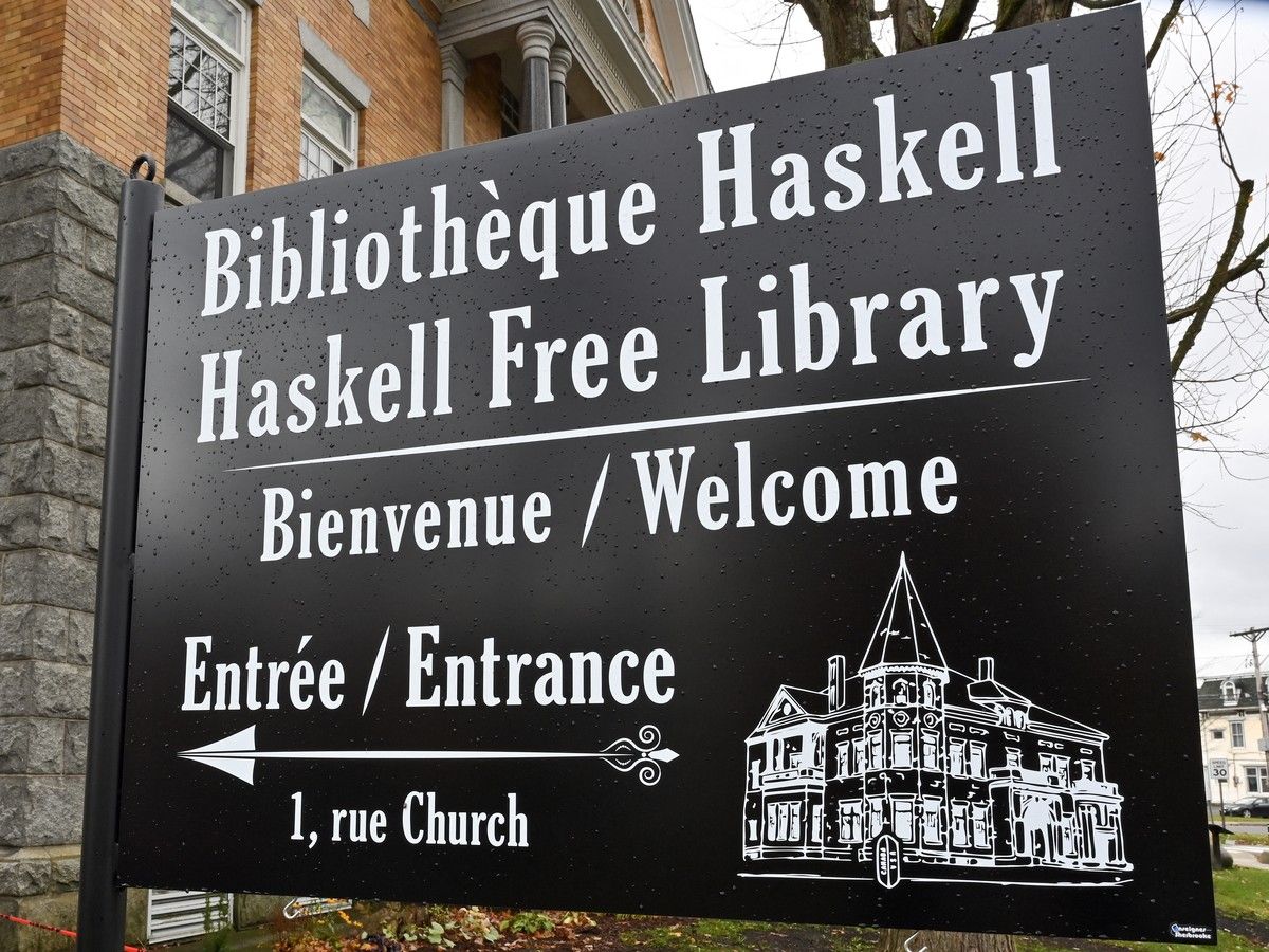 A sign indicates the new entrance on the Canadian side of the cross-border Haskell Library in Stanstead, Quebec. A sign indicates the new entrance on the Canadian side of the cross-border Haskell Library in Stanstead, Quebec.