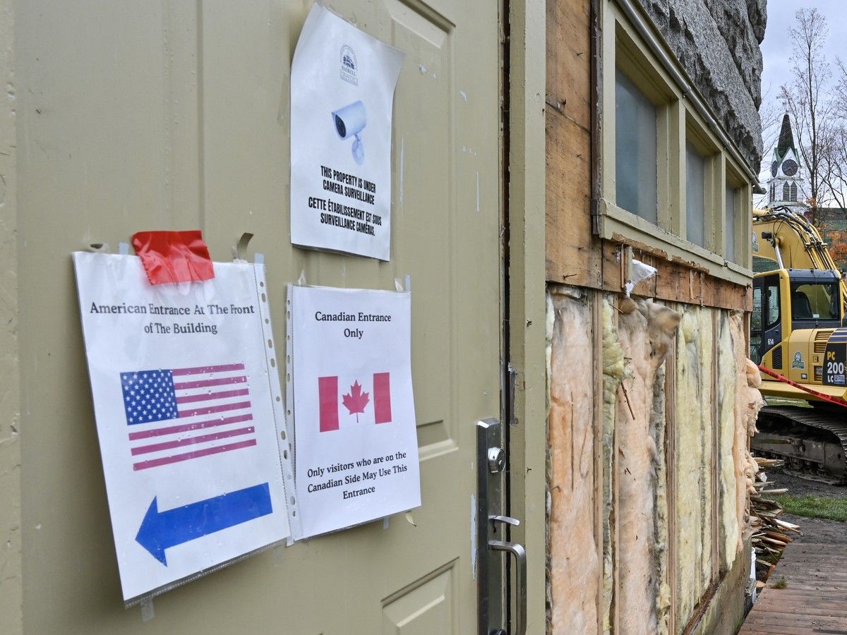 Signs are posted on the former emergency exit as it’s converted into the Canadian side entrance of the cross-border Haskell Library in Stanstead, Quebec. Signs are posted on the former emergency exit as it’s converted into the Canadian side entrance of the cross-border Haskell Library in Stanstead, Quebec.