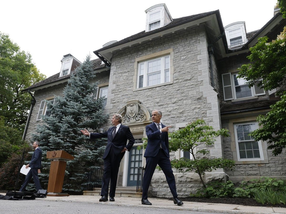  Prime Minister Mark Carney, with board chair of the Rideau Hall Foundation Robert Prichard, leaves a press conference at 24 Sussex in Ottawa June 25, 2026.