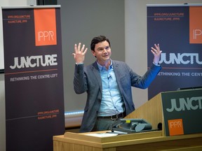 French economist Thomas Piketty speaks to students and guests during a presentation at King's College, central London, on April 30, 2014.