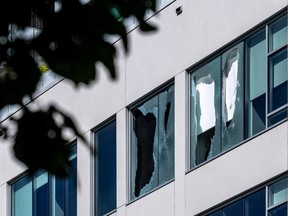 Broken windows at a shooting scene.