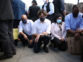 Trudeau kneeling