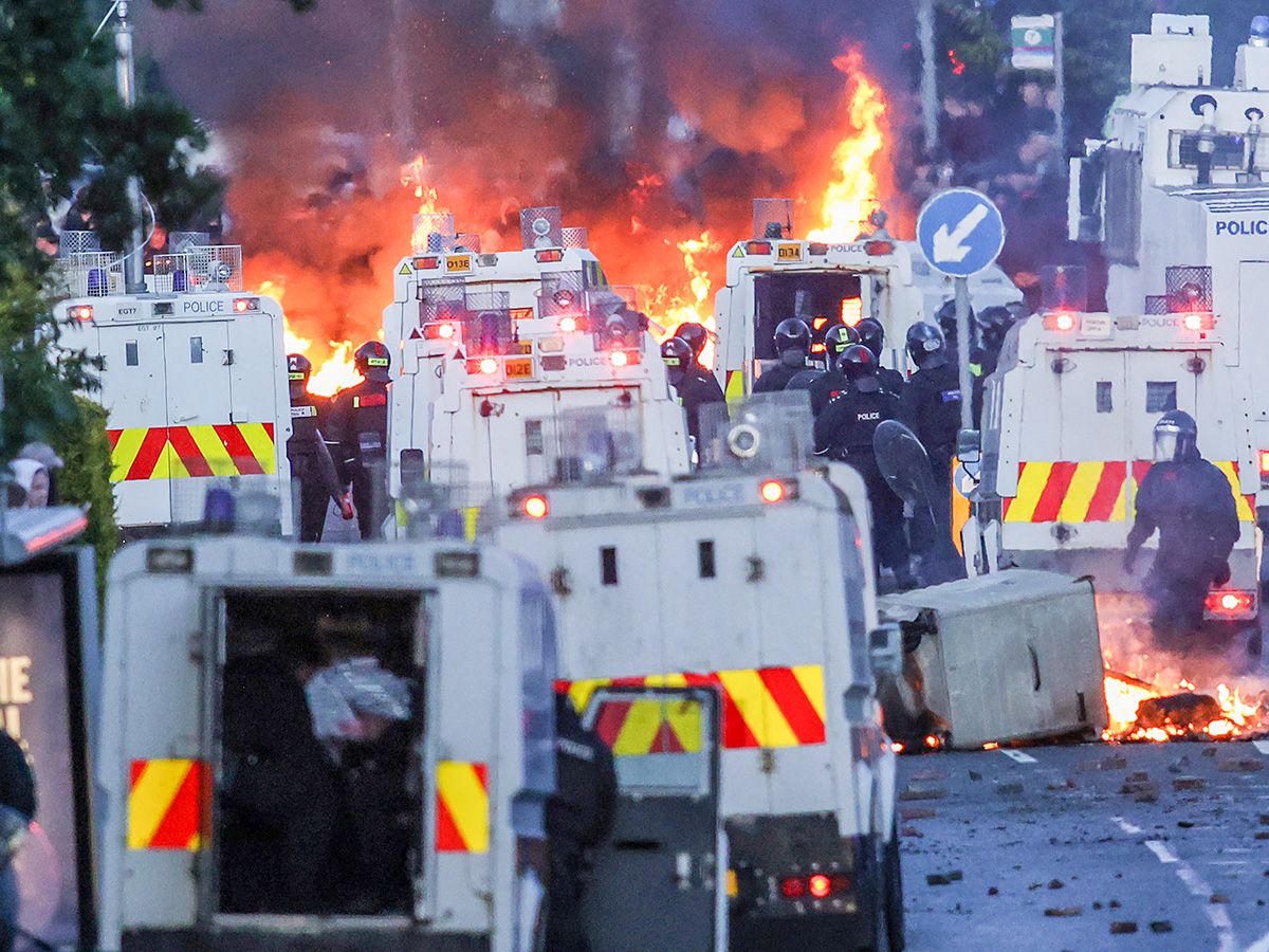 ‘People do crimes, we bear the burden’: Migrants ‘hiding’ amid violent anti-immigration protests in Belfast