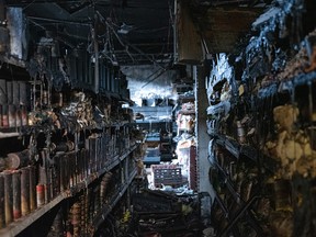 Shelves with burned cans of food.
