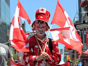 A man dressed in Canadian flag motif.