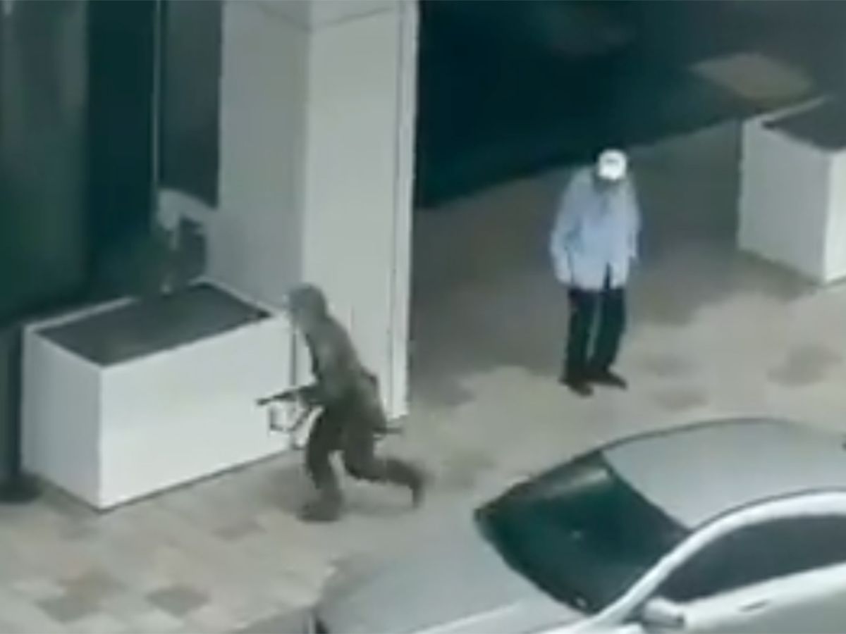  The suspected shooter, left, runs past a bystander and toward police during a deadly shooting incident in Montreal on Monday, June 22, 2026.