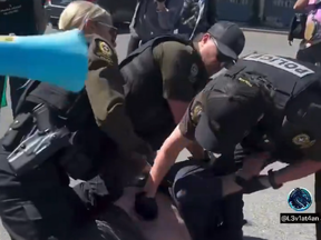 SQ officers and Andre Therrien