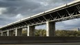 The Leaside Bridge in Toronto with a grey, cloudy sky in the background.