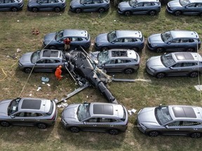 An aerial view shows the site of a helicopter crash in the Recreio dos Bandeirantes neighbourhood, in Rio de Janeiro, Brazil, on June 14, 2026. At least six people died in Brazil on June 14 after two helicopters crashed in western Rio de Janeiro, after a suspected mid-air collision, firefighters said.