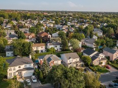 Aerial view of houses and streets in a leafy area of Montreal.