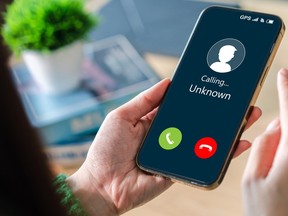 A hand holding a phone.