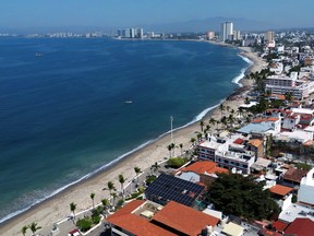 Aerial view of a beach in Puerto Vallarta under a blue sky.