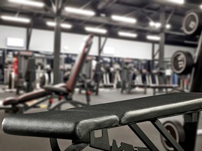 Benches and weights at a gym.
