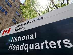 A sign with a Canadian flag reading 'Canadian Revenue Agency National Headquarters'