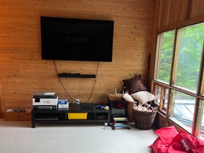 Moving the TV to the wall opposite will make use of a deeper bank of space for furniture to hold video games and cables.