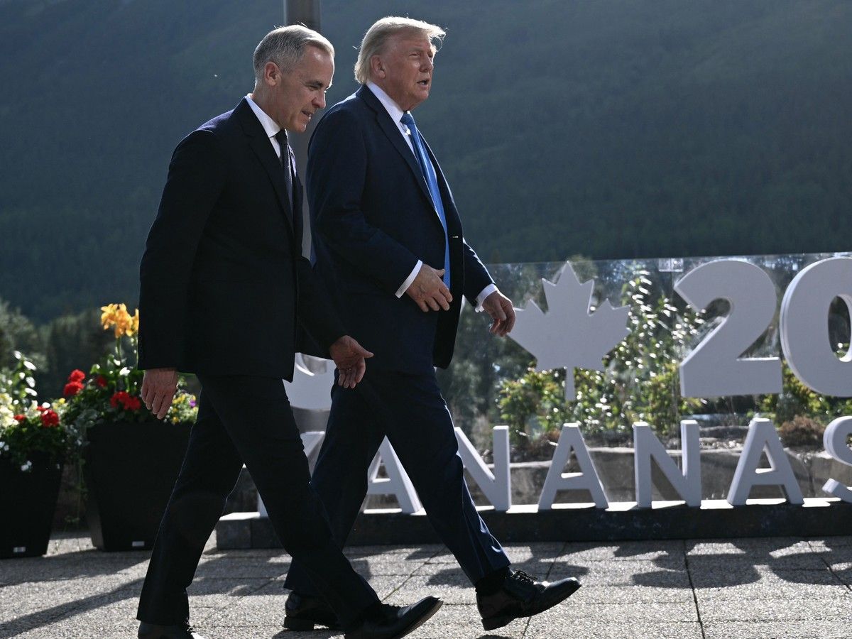 Prime Minister Mark Carney and U.S. President Donald Trump arrive for a family photo during the G7 Summit at the Kananaskis Country Golf Course in Kananaskis, Alberta, Canada, on June 16, 2025. Prime Minister Mark Carney and U.S. President Donald Trump arrive for a family photo during the G7 Summit at the Kananaskis Country Golf Course in Kananaskis, Alberta, Canada, on June 16, 2025.