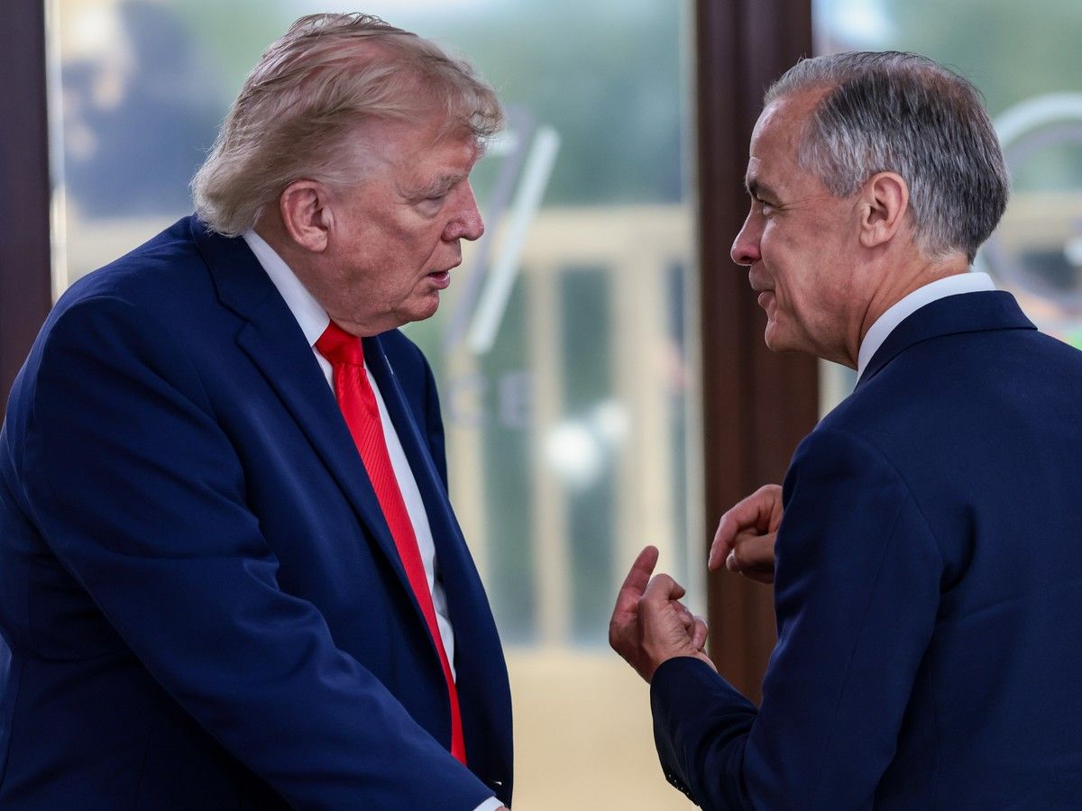 U.S. President Donald Trump speaks with Canadian Prime Minister Mark Carney at a working lunch with leaders of G7 and the Middle East, on June 16, 2026 in Evian-les-Bains, France. 