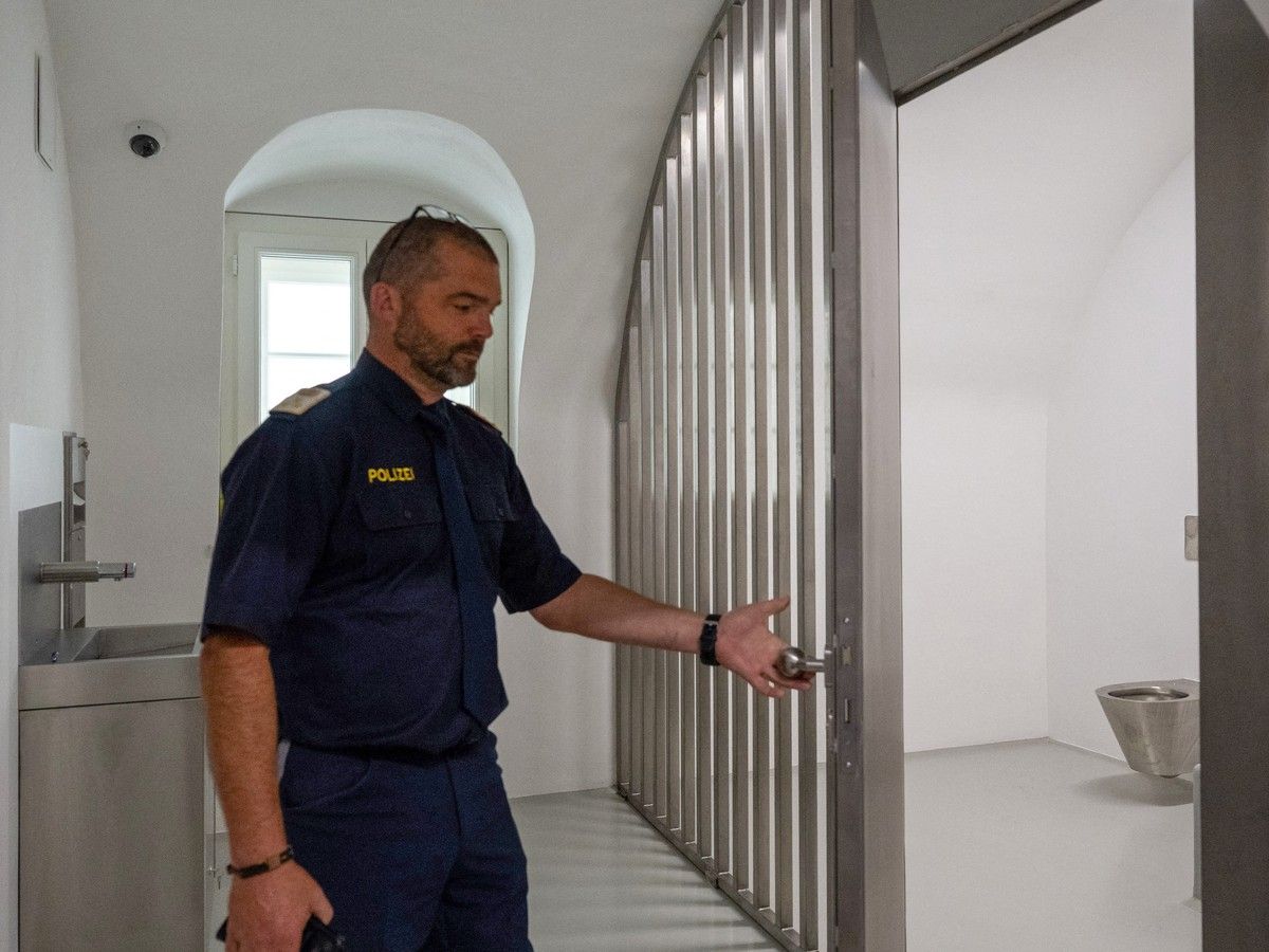  Police chief inspector Kurt Reiter opening a prison cell inside the newly opened police station.