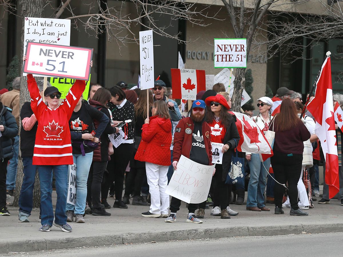  People rally against U.S. President Donald Trump’s “51st state” talk outside of the U.S. consulate in Calgary on March 24, 2025.