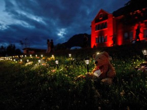 Teddy bear sits outside a former Kamloops Indian Residential School.