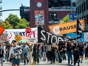 Protesters carrying signs.
