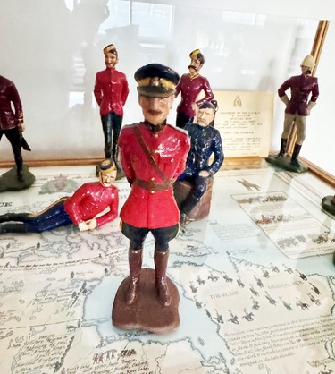 Joe Atherton's hand-painted carvings of RCMP and North West Police uniforms on display at the officers mess in Vancouver.